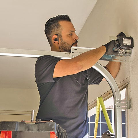 Man repairing a garage door