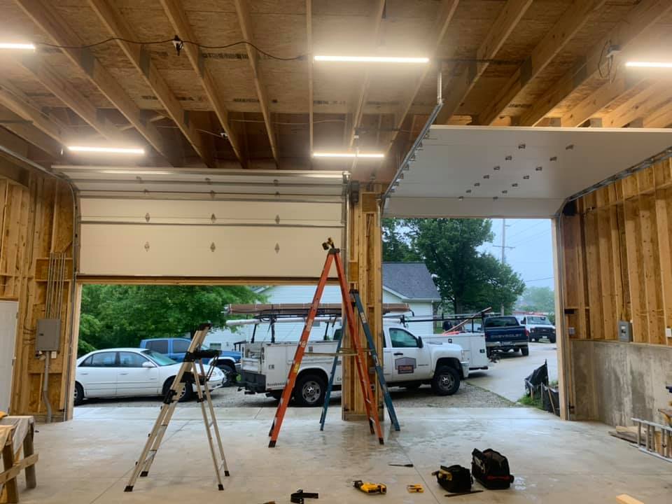 Gateway Door staff installing a garage door panel
