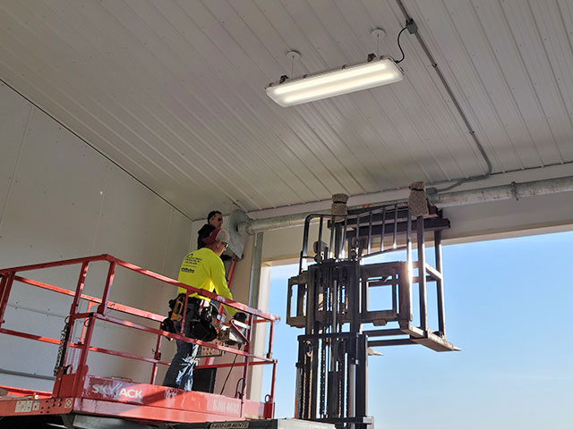 Gateway commercial team repairing a commercial garage door