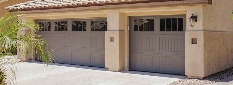 A house with two grey garage doors