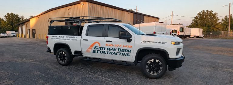 A Gateway Door and Contracting service truck parked outside the company warehouse in St. Charles